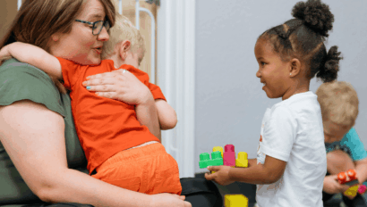 Woman hugging child.